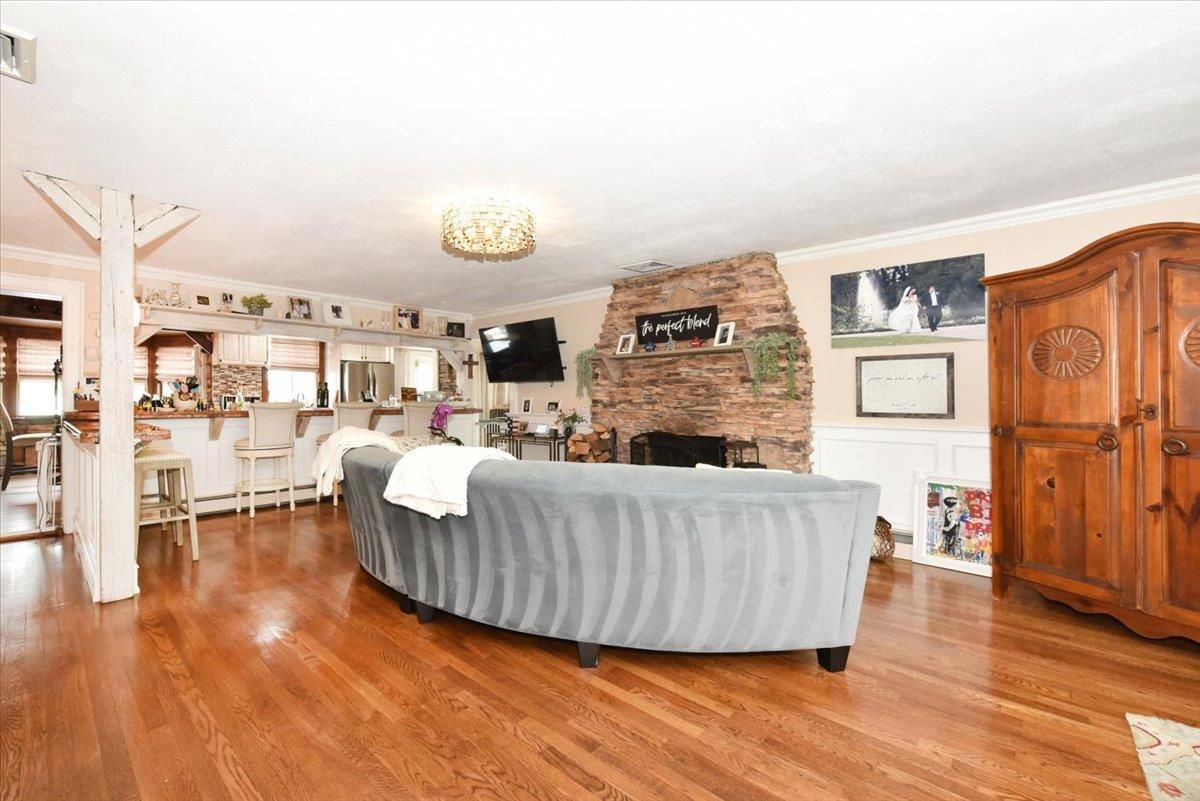 Chandelier, Fireplace, Interior, Kitchen, Living room, Stone Walls, Wood Texture Flooring