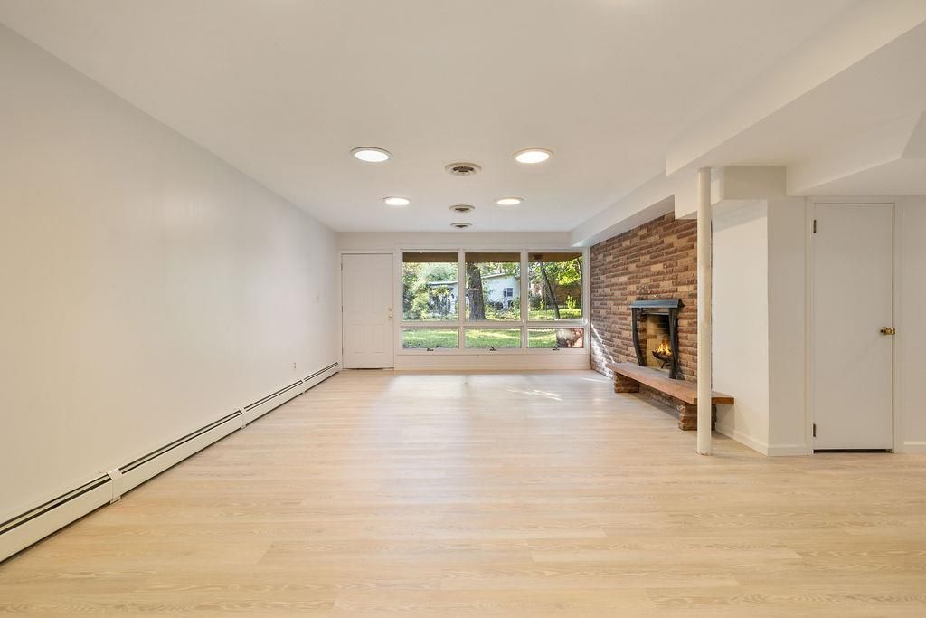 Empty room, Fireplace, Interior, Recessed Lighting, Stone Walls, Wood Texture Flooring