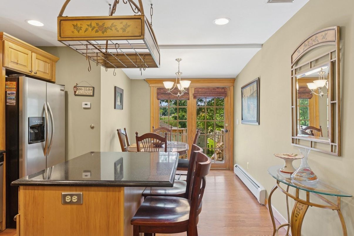 Chandelier, Dining room, Interior, Kitchen, Recessed Lighting, Stainless Steel Appliances, Wood Texture Flooring