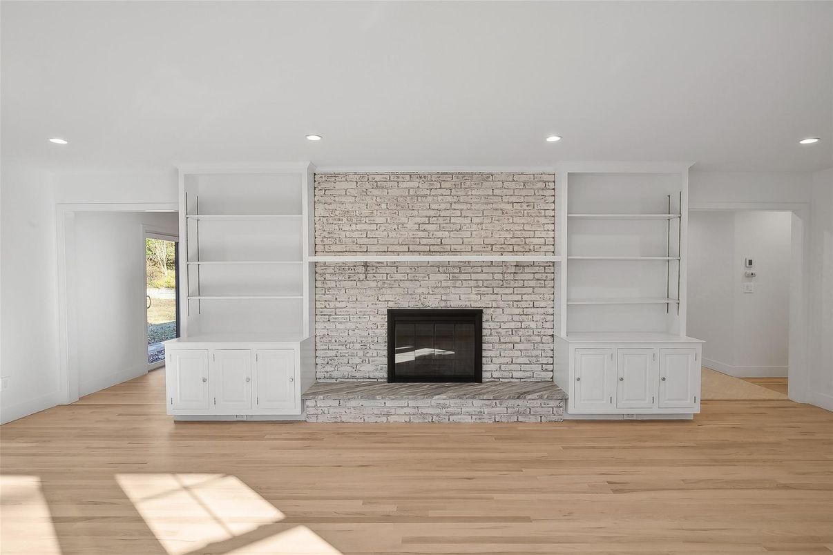 Empty room, Fireplace, Interior, Recessed Lighting, Stone Walls, Wood Texture Flooring