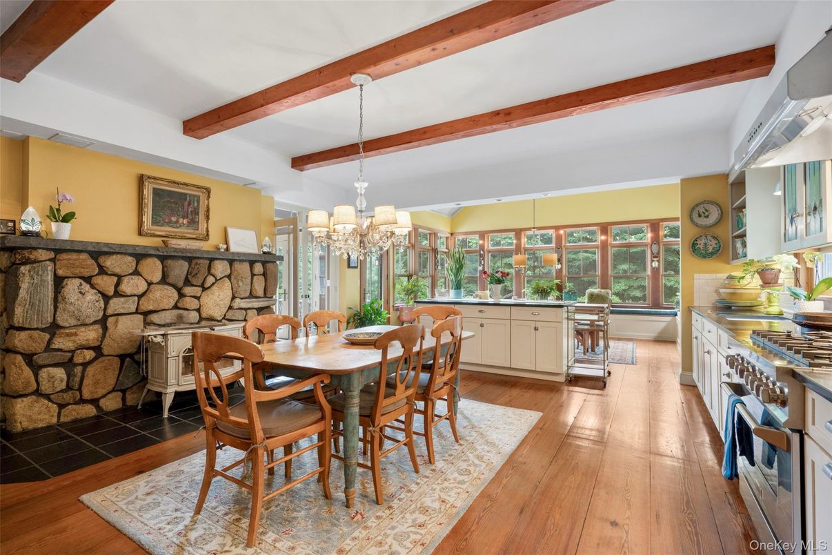 Chandelier, Dining room, Fireplace, Interior, Stone Walls, Wooden Beams, Wood Texture Flooring