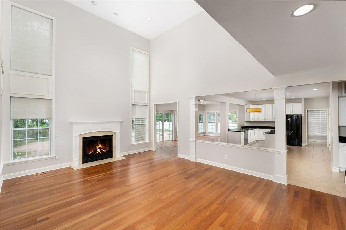 Empty room, Fireplace, Interior, Kitchen, Pendant Lights, Recessed Lighting, Wood Texture Flooring