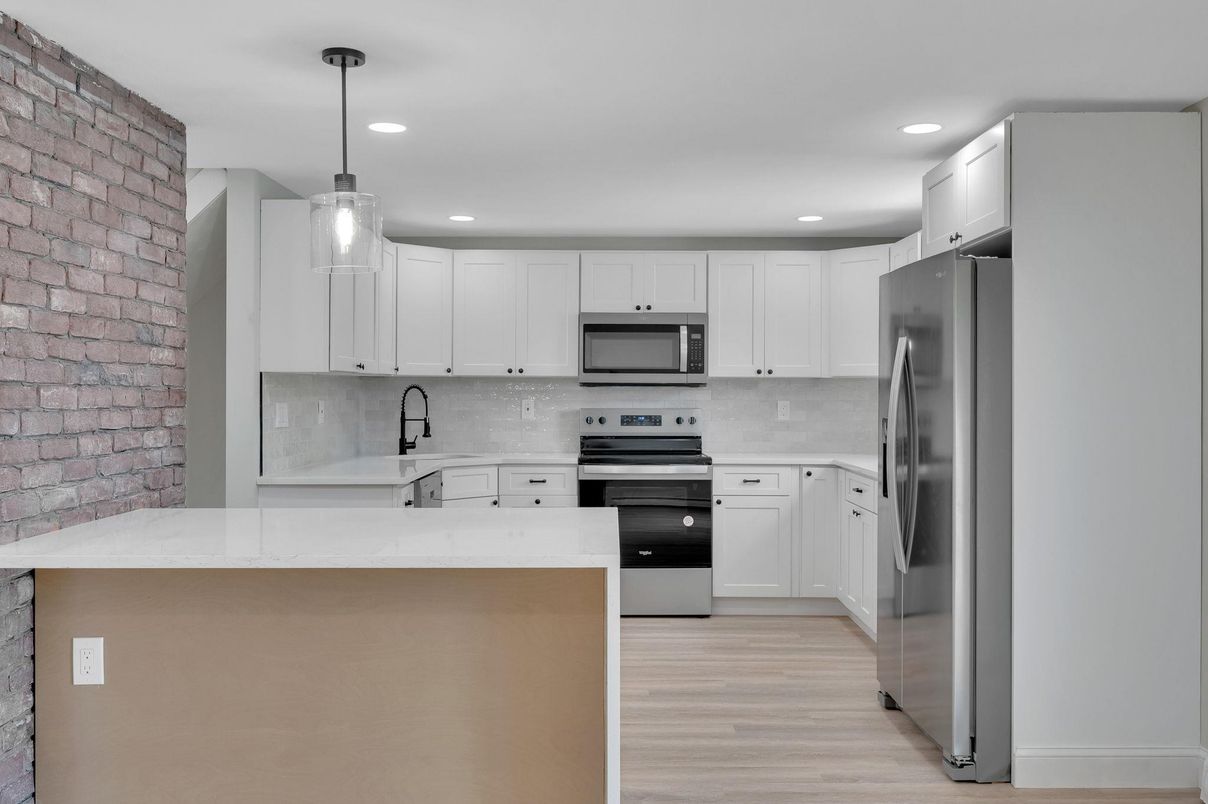 Interior, Kitchen, Pendant Lights, Recessed Lighting, Stainless Steel Appliances, Stone Walls, Wood Texture Flooring