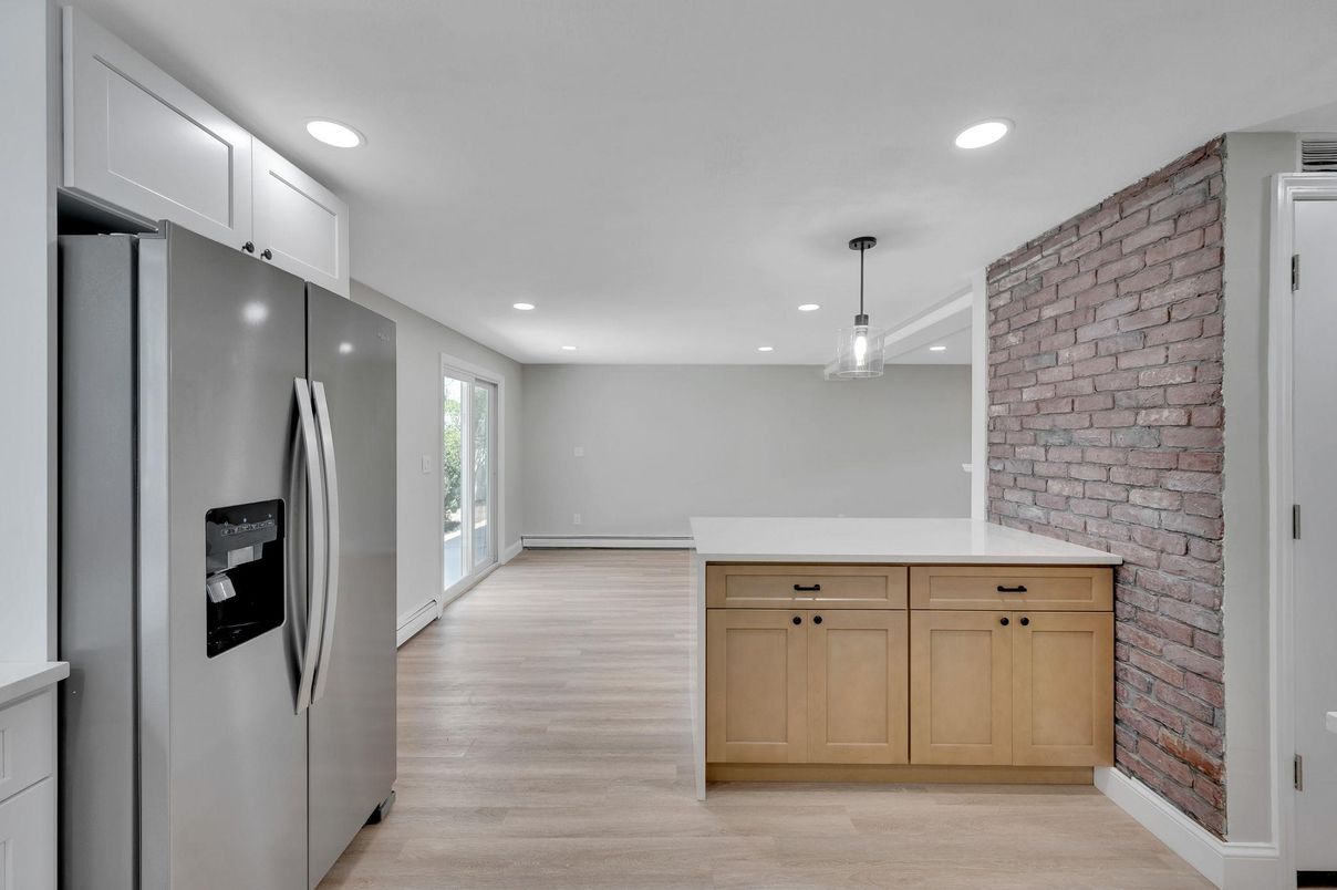 Interior, Kitchen, Pendant Lights, Recessed Lighting, Stainless Steel Appliances, Stone Walls, Wood Texture Flooring