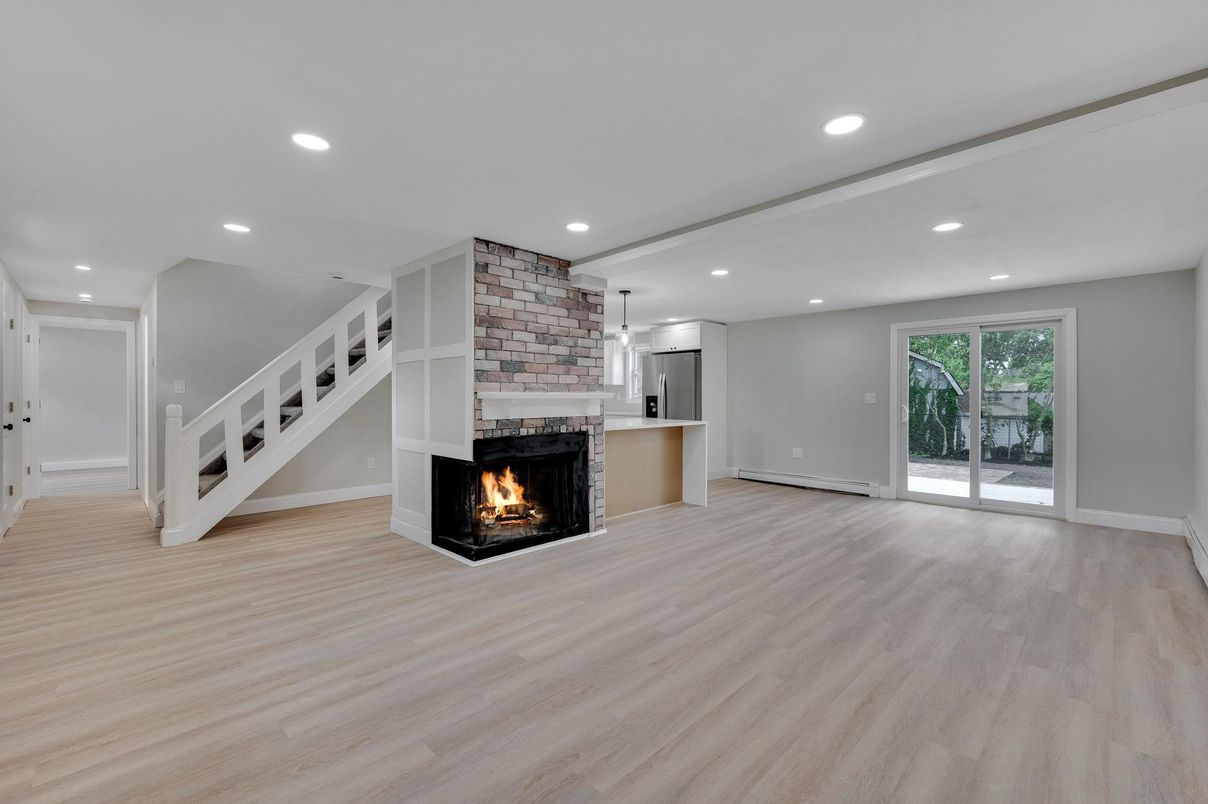 Empty room, Fireplace, Interior, Pendant Lights, Recessed Lighting, Wood Texture Flooring