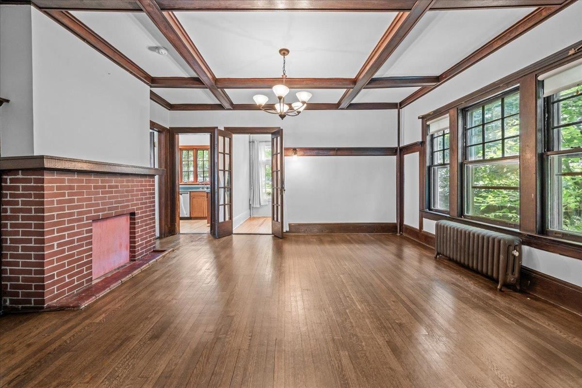 Chandelier, Empty room, Fireplace, Interior, Stone Walls, Wooden Beams, Wood Texture Flooring