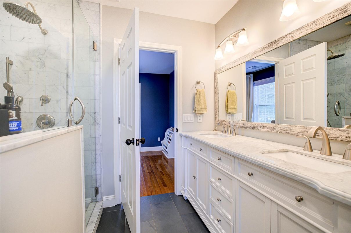 Bathroom, Dual Sink Vanities, Glass Shower, Interior, Marble Walls, Wood Texture Flooring