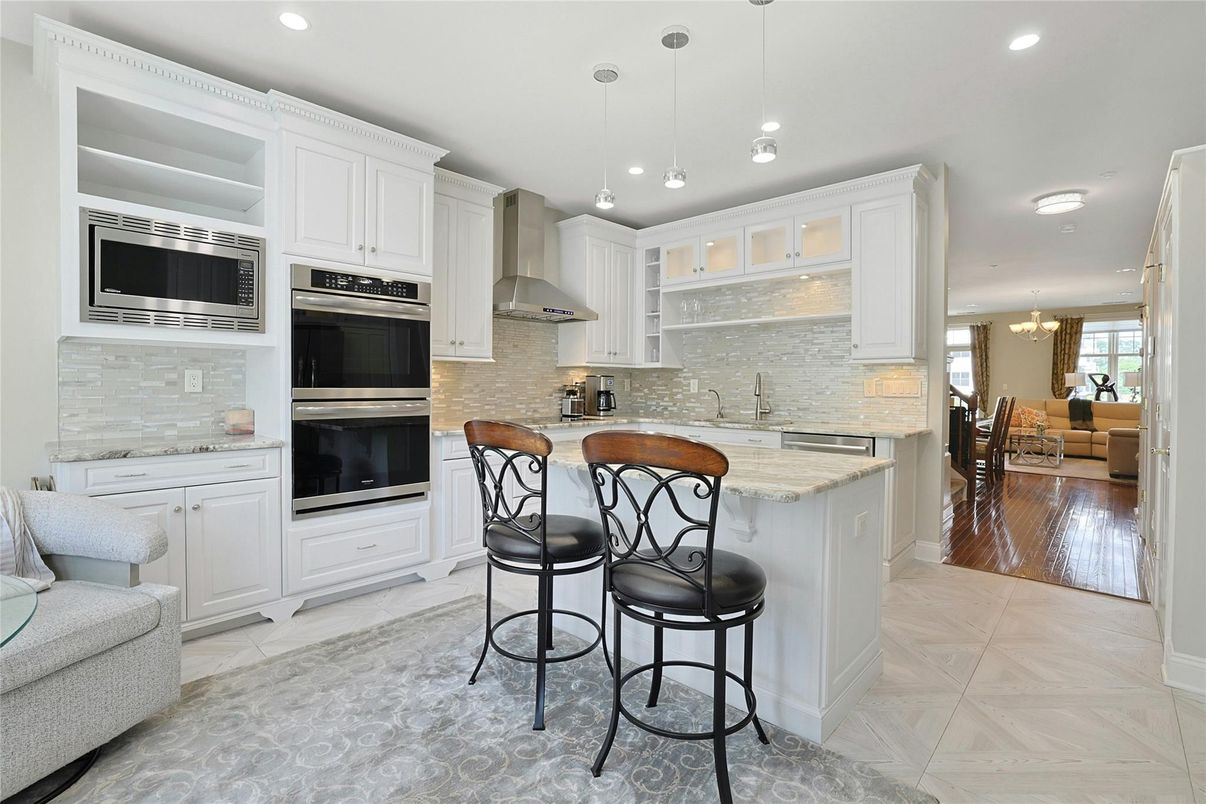 Chandelier, Dining room, Interior, Kitchen, Pendant Lights, Recessed Lighting, Stainless Steel Appliances, Wood Texture Flooring