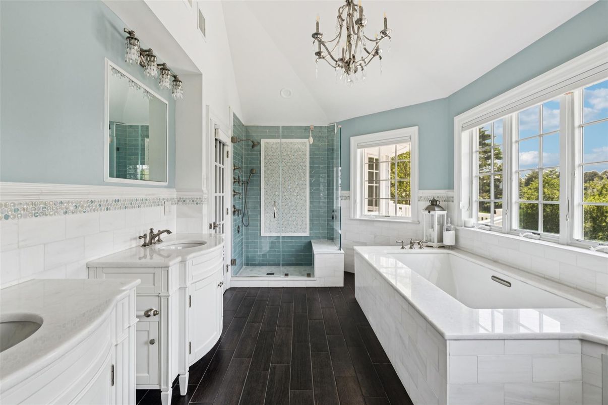 Bathroom, Chandelier, Dual Sink Vanities, Glass Shower, Interior, Wood Texture Flooring