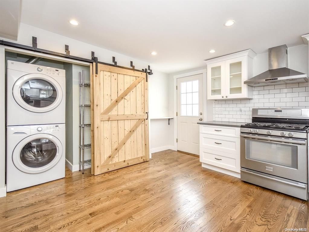 Interior, Kitchen, Recessed Lighting, Stainless Steel Appliances, Utility Closets, Washer, Wood Texture Flooring