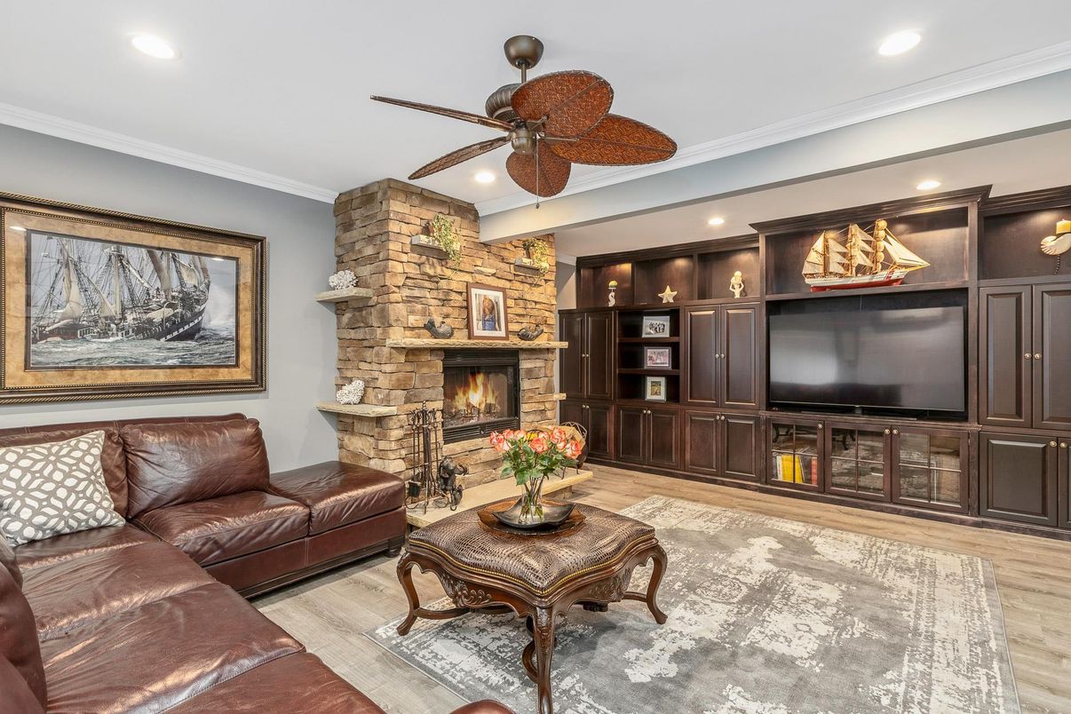 Fireplace, Interior, Living room, Recessed Lighting, Stone Walls, Wood Texture Flooring