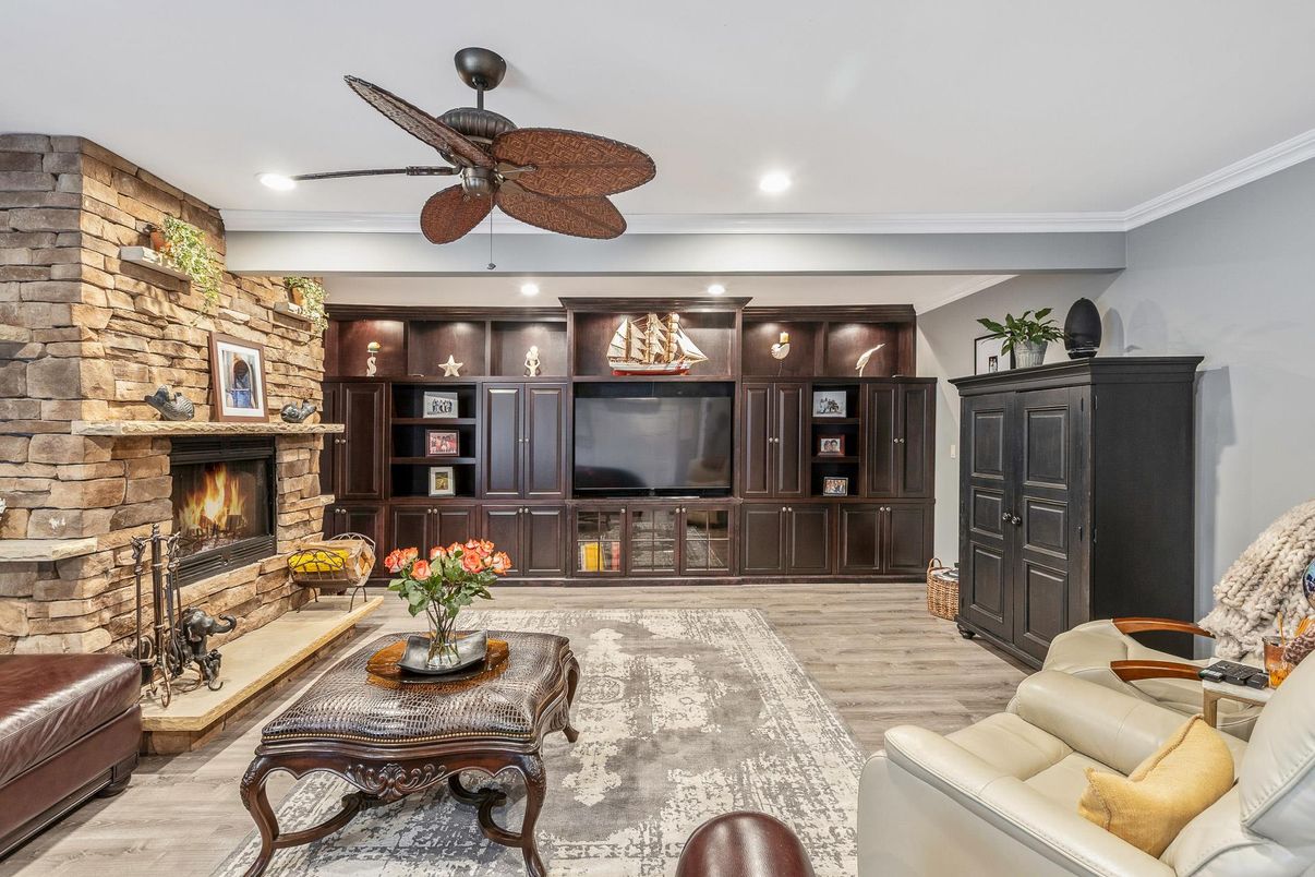 Fireplace, Interior, Living room, Recessed Lighting, Stone Walls, Wood Texture Flooring