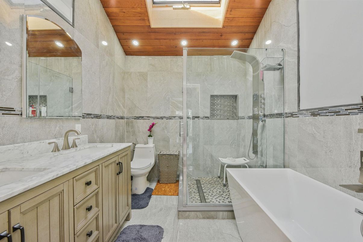 Bathroom, Dual Sink Vanities, Free Standing Baths, Glass Shower, Interior, Recessed Lighting, Wooden Ceilings