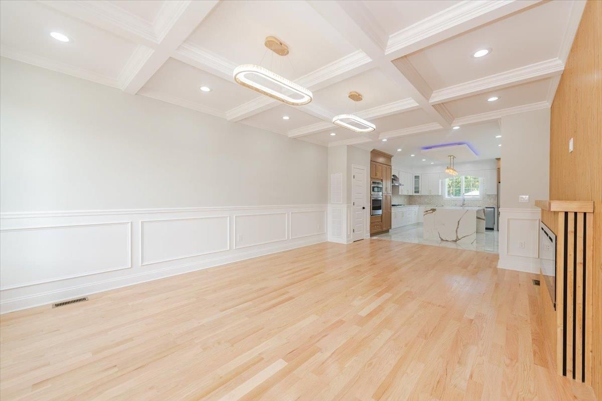 Empty room, Interior, Kitchen, Pendant Lights, Recessed Lighting, Stainless Steel Appliances, Wood Texture Flooring