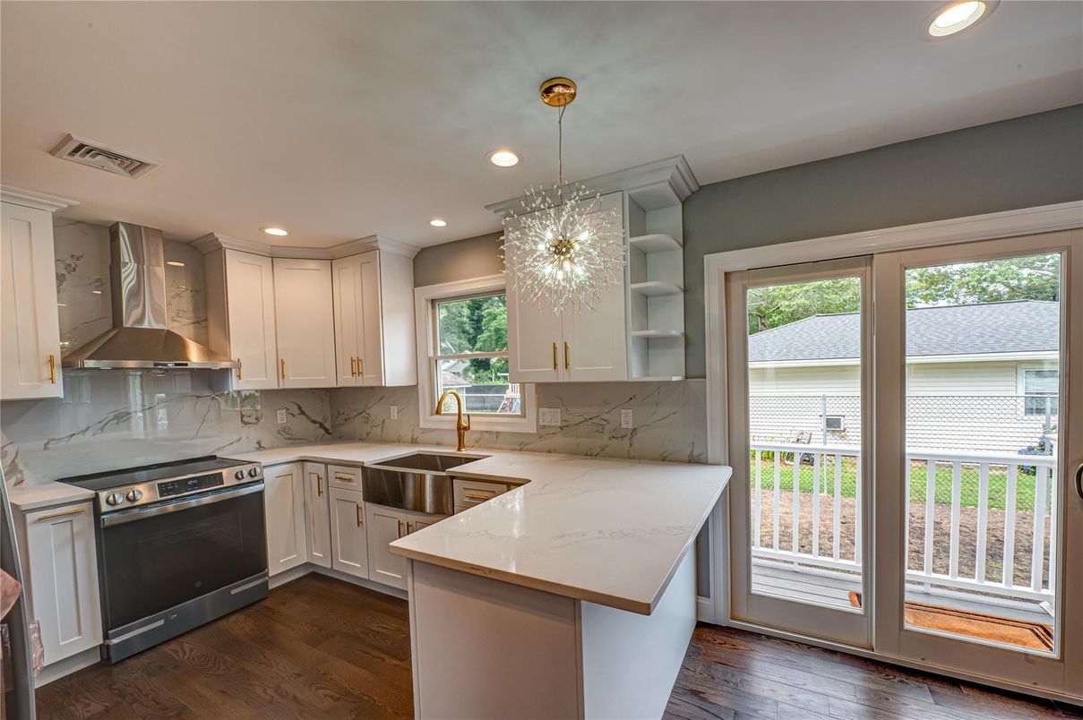 Interior, Kitchen, Marble Walls, Pendant Lights, Recessed Lighting, Stainless Steel Appliances, Wood Texture Flooring