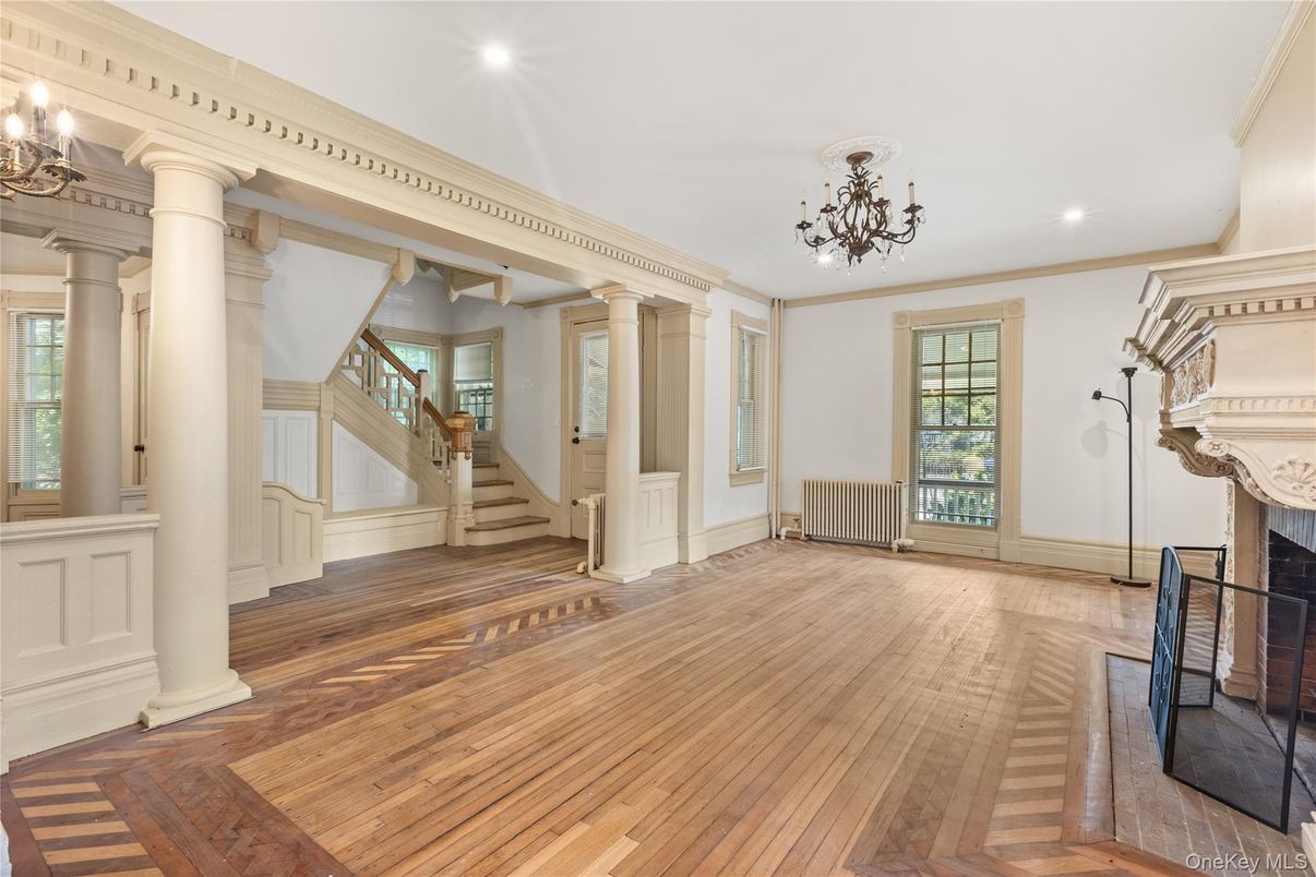 Chandelier, Empty room, Fireplace, Interior, Recessed Lighting, Wood Texture Flooring