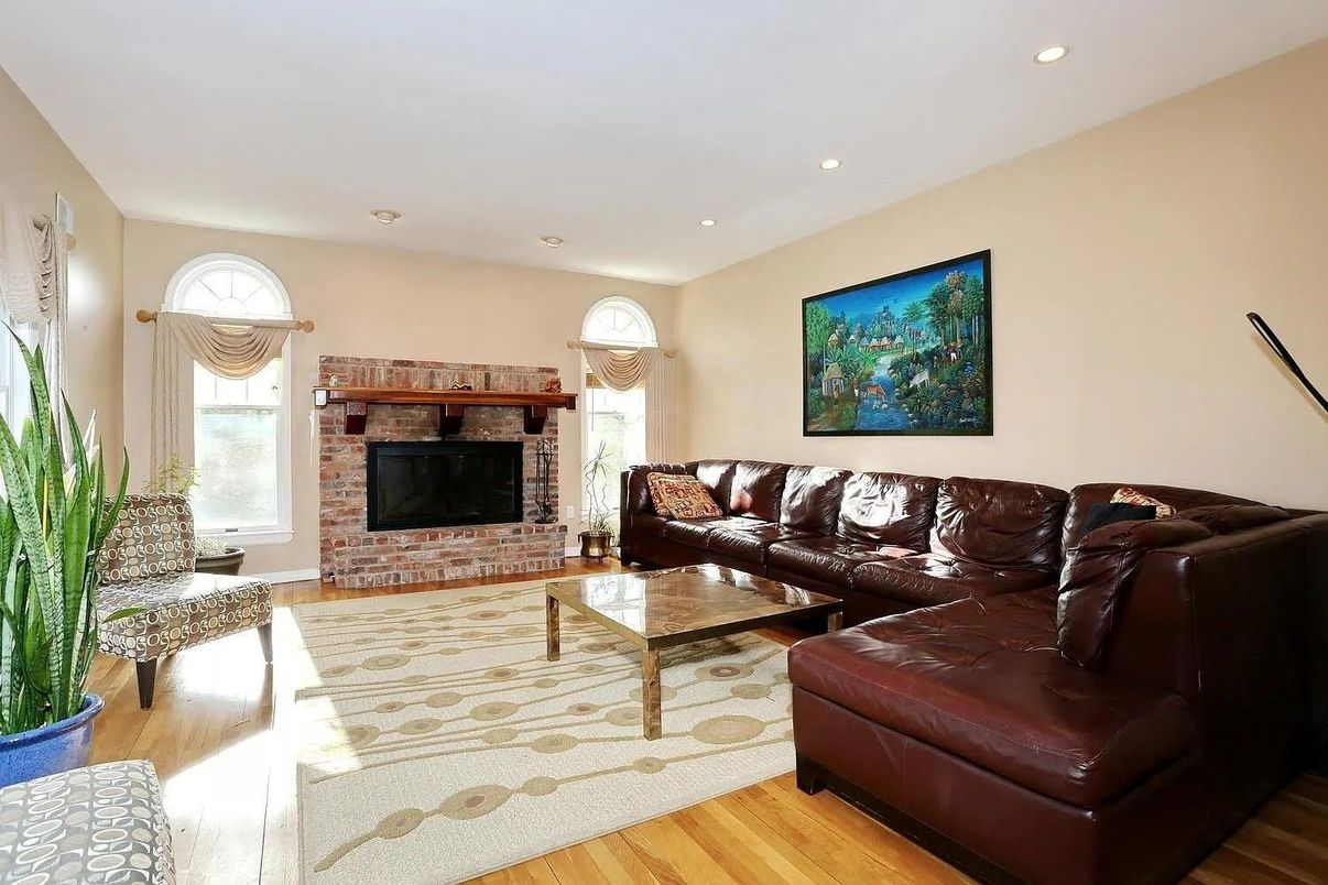 Fireplace, Interior, Living room, Recessed Lighting, Stone Walls, Wood Texture Flooring