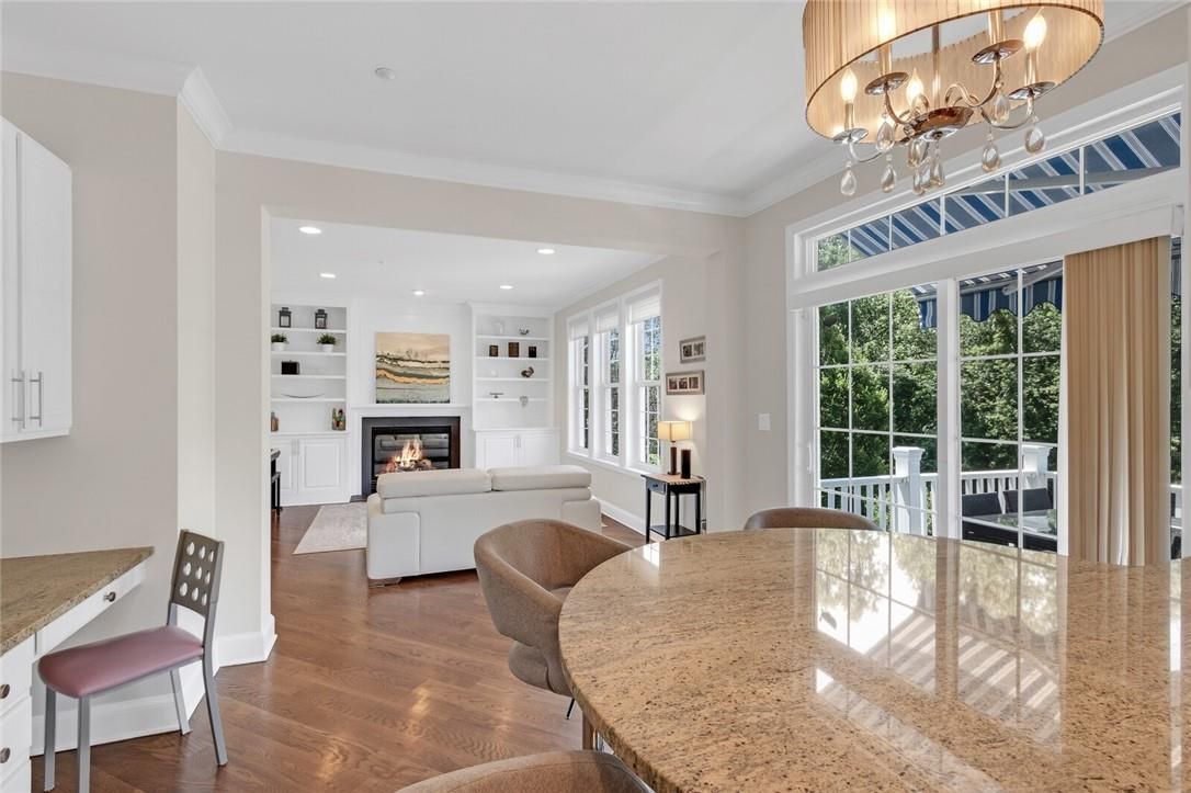 Chandelier, Dining room, Fireplace, Interior, Living room, Recessed Lighting, Wood Texture Flooring
