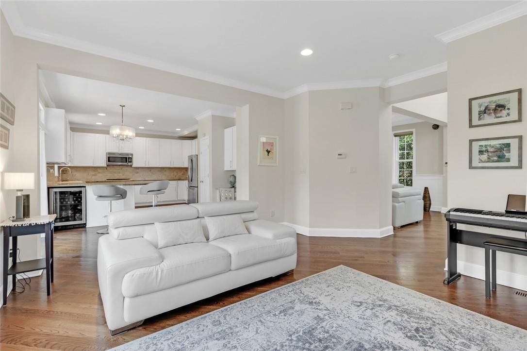 Chandelier, Interior, Kitchen, Living room, Recessed Lighting, Stainless Steel Appliances, Wood Texture Flooring