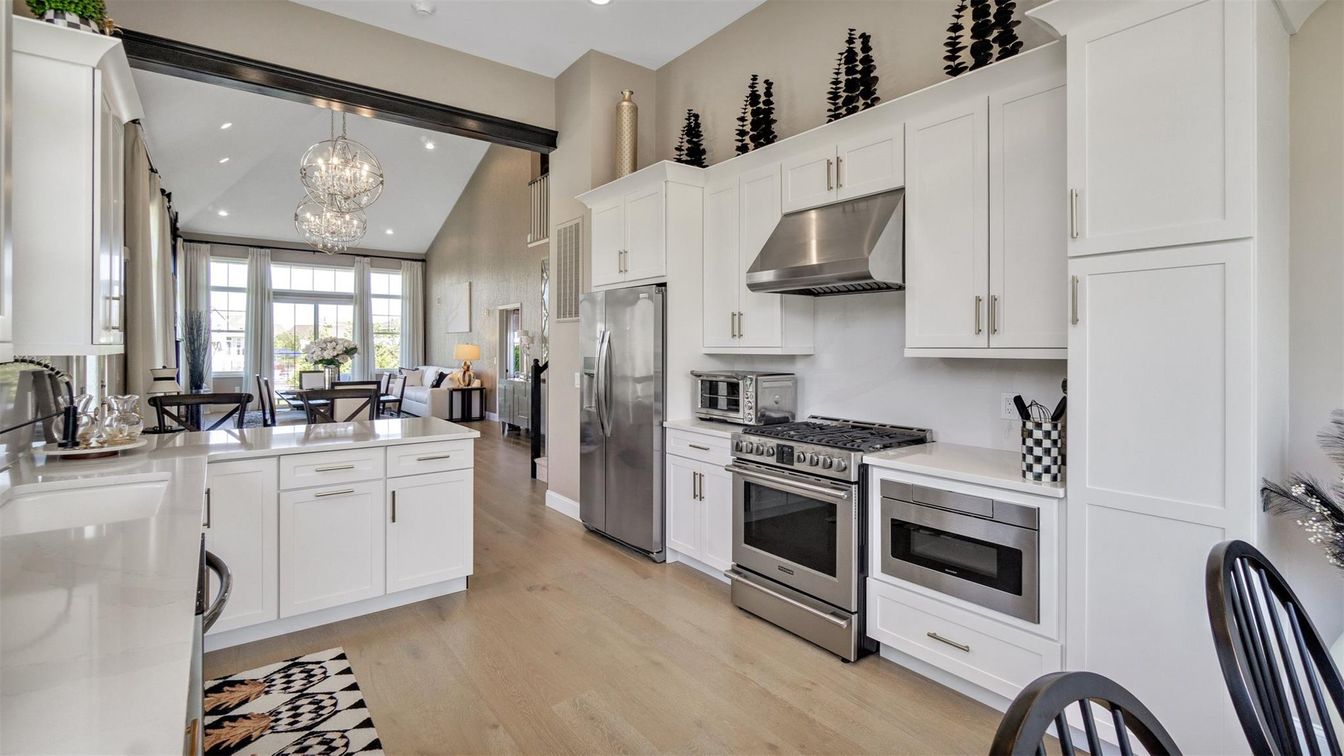 Chandelier, Dining room, Interior, Kitchen, Pendant Lights, Recessed Lighting, Stainless Steel Appliances, Wood Texture Flooring