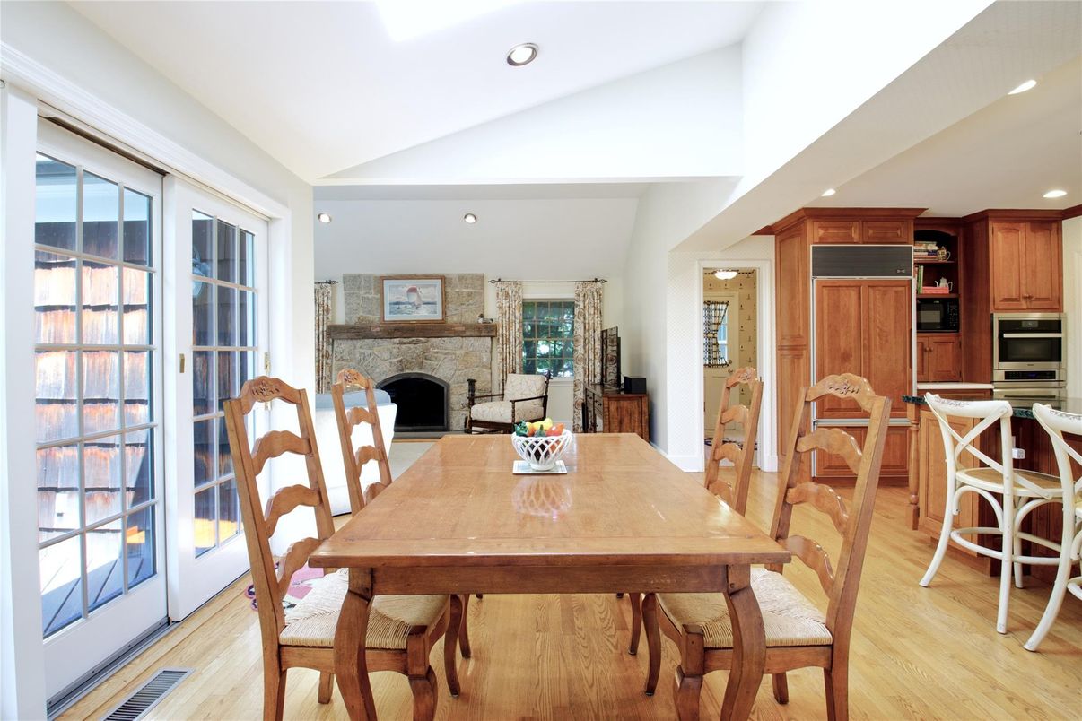 Dining room, Fireplace, Interior, Kitchen, Recessed Lighting, Wood Texture Flooring