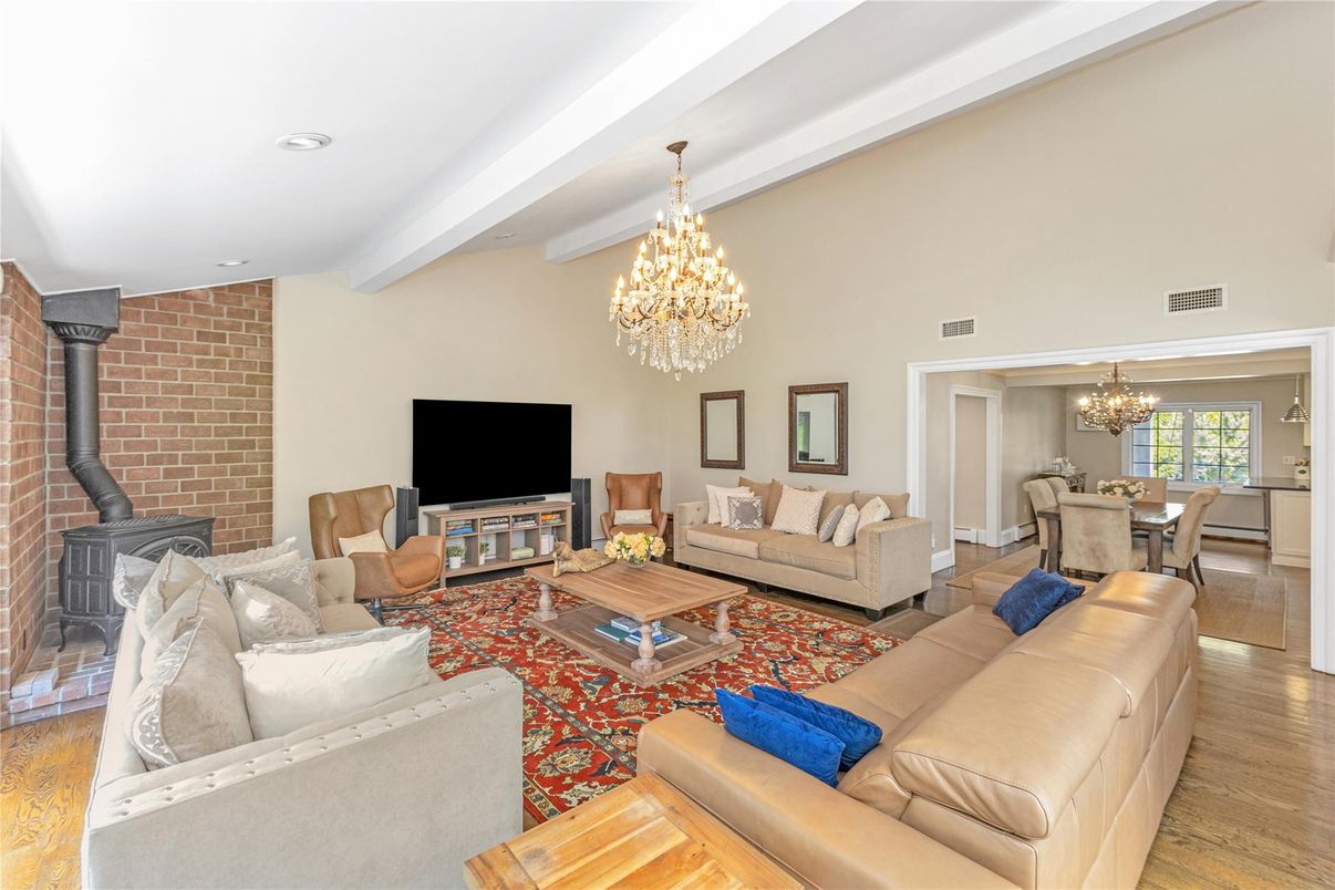 Chandelier, Dining room, Interior, Living room, Recessed Lighting, Stone Walls, Wood Texture Flooring