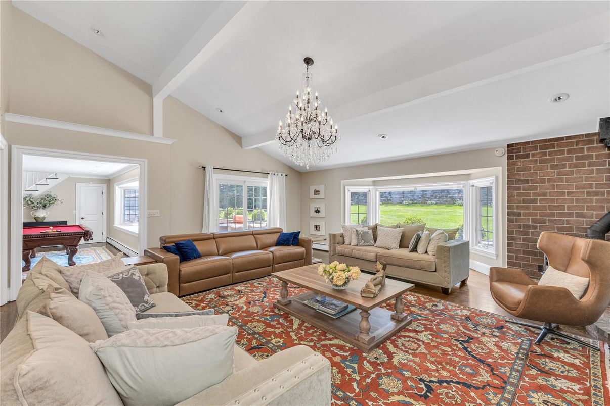 Billiard Table, Chandelier, Game Room, Interior, Living room, Recessed Lighting, Stone Walls, Wood Texture Flooring