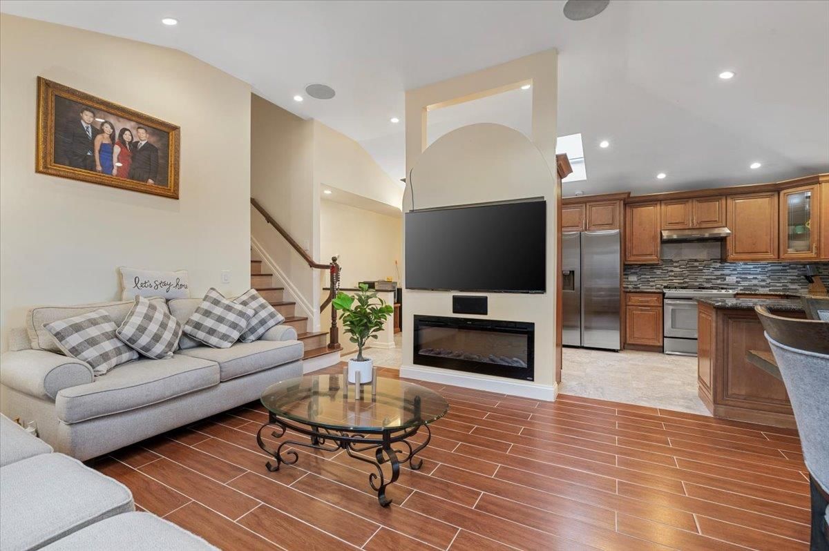 Fireplace, Interior, Kitchen, Living room, Recessed Lighting, Stainless Steel Appliances, Wood Texture Flooring