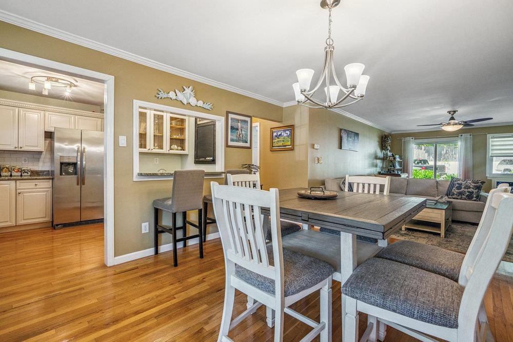 Chandelier, Dining room, Interior, Kitchen, Living room, Stainless Steel Appliances, Wood Texture Flooring