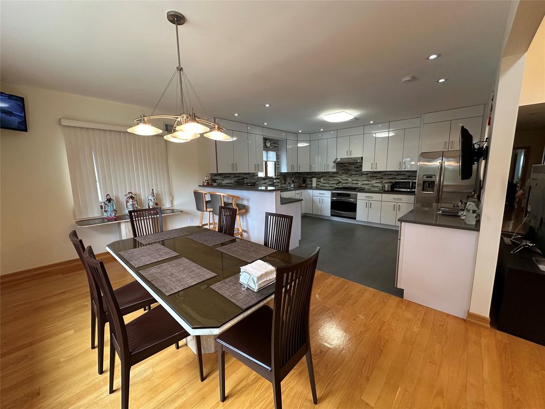 Dining room, Interior, Kitchen, Pendant Lights, Recessed Lighting, Stainless Steel Appliances, Wood Texture Flooring