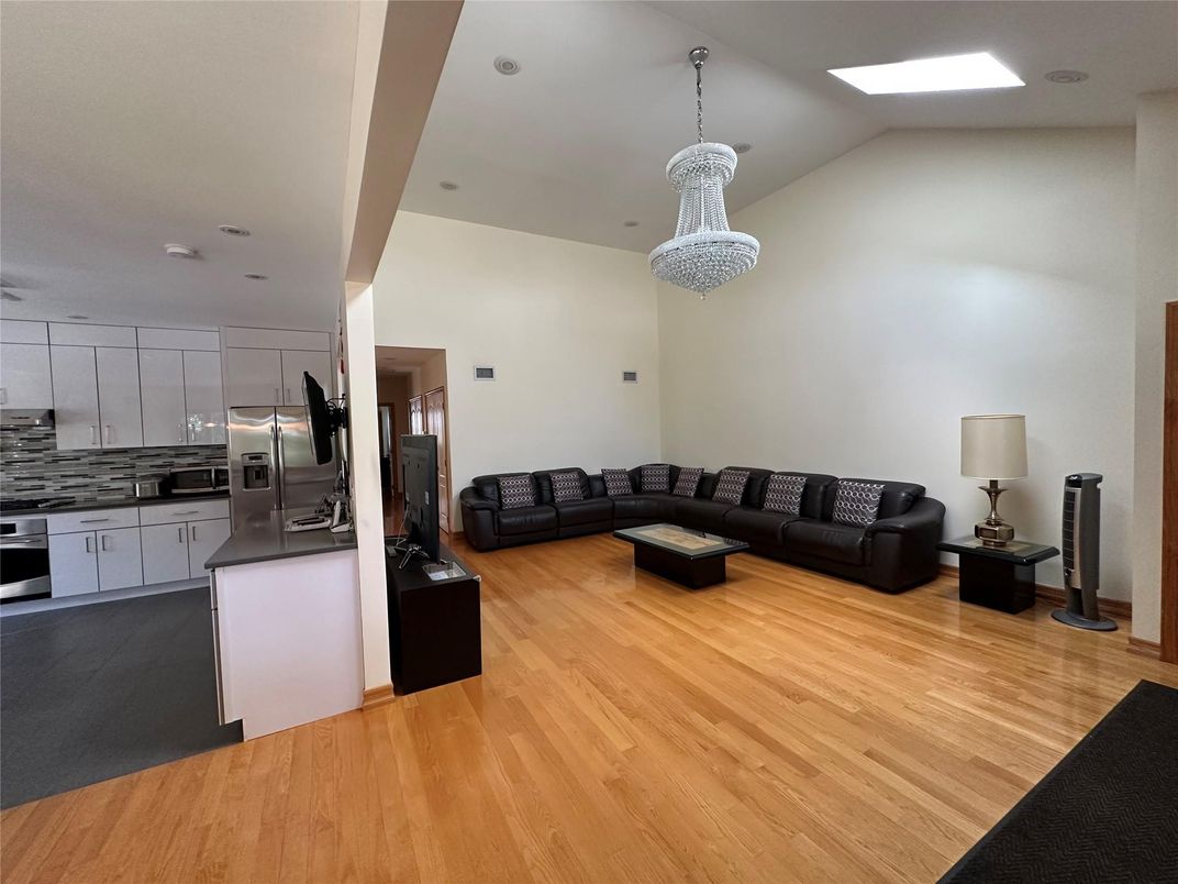 Chandelier, Interior, Kitchen, Living room, Recessed Lighting, Stainless Steel Appliances, Wood Texture Flooring