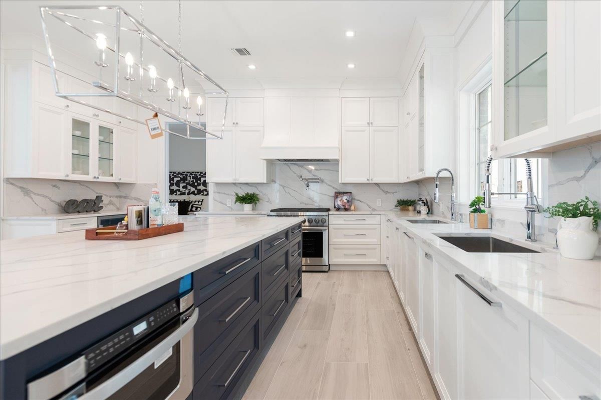 Interior, Kitchen, Marble Walls, Pendant Lights, Recessed Lighting, Stainless Steel Appliances, Wood Texture Flooring