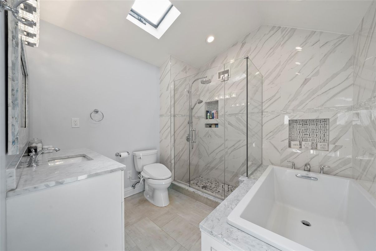 Bathroom, Dual Sink Vanities, Glass Shower, Interior, Marble Walls, Recessed Lighting