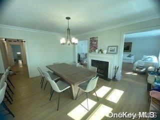 Chandelier, Dining room, Fireplace, Interior, Pendant Lights, Wood Texture Flooring