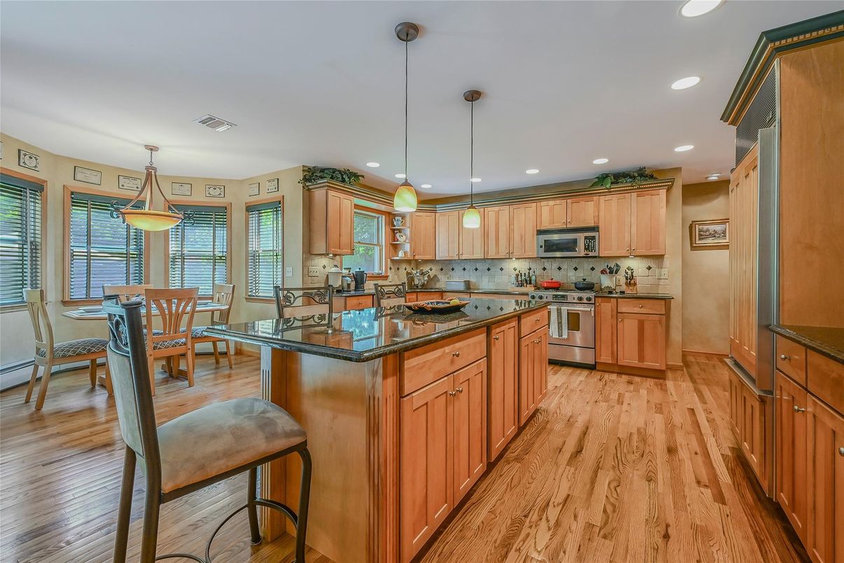 Dining room, Interior, Kitchen, Pendant Lights, Recessed Lighting, Stainless Steel Appliances, Wood Texture Flooring