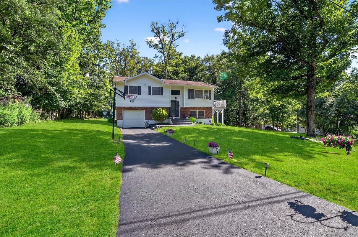 Attached, Backyard, Exterior, Facade, Brick Facade, Raised Ranch