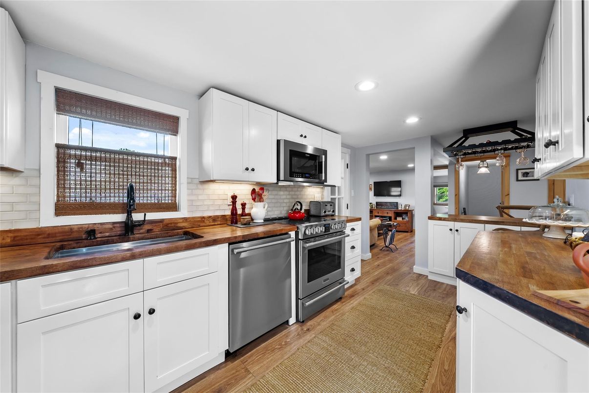 Dining room, Interior, Kitchen, Recessed Lighting, Stainless Steel Appliances, Wood Texture Flooring