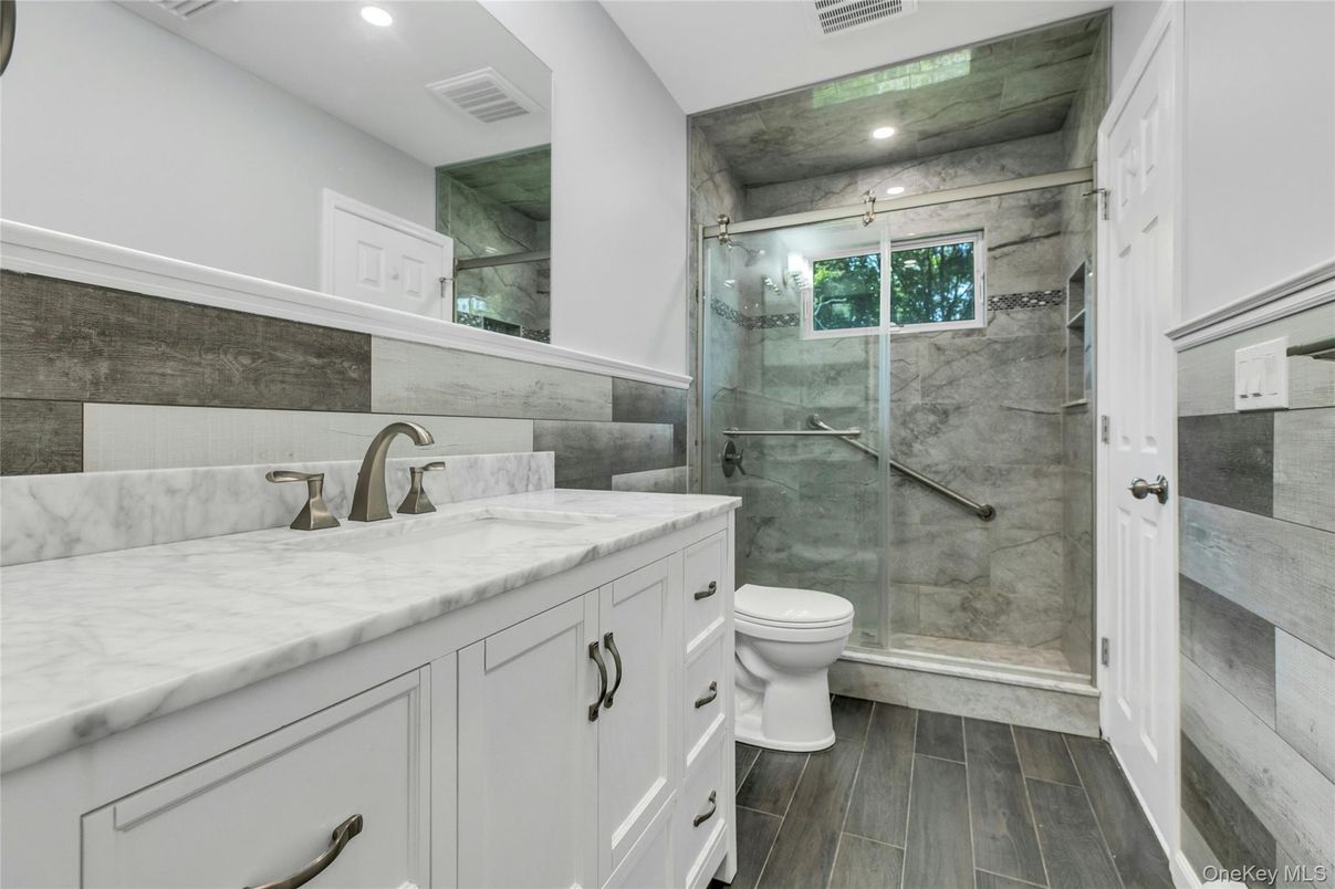 Bathroom, Glass Shower, Interior, Marble Walls, Recessed Lighting, Wood Texture Flooring