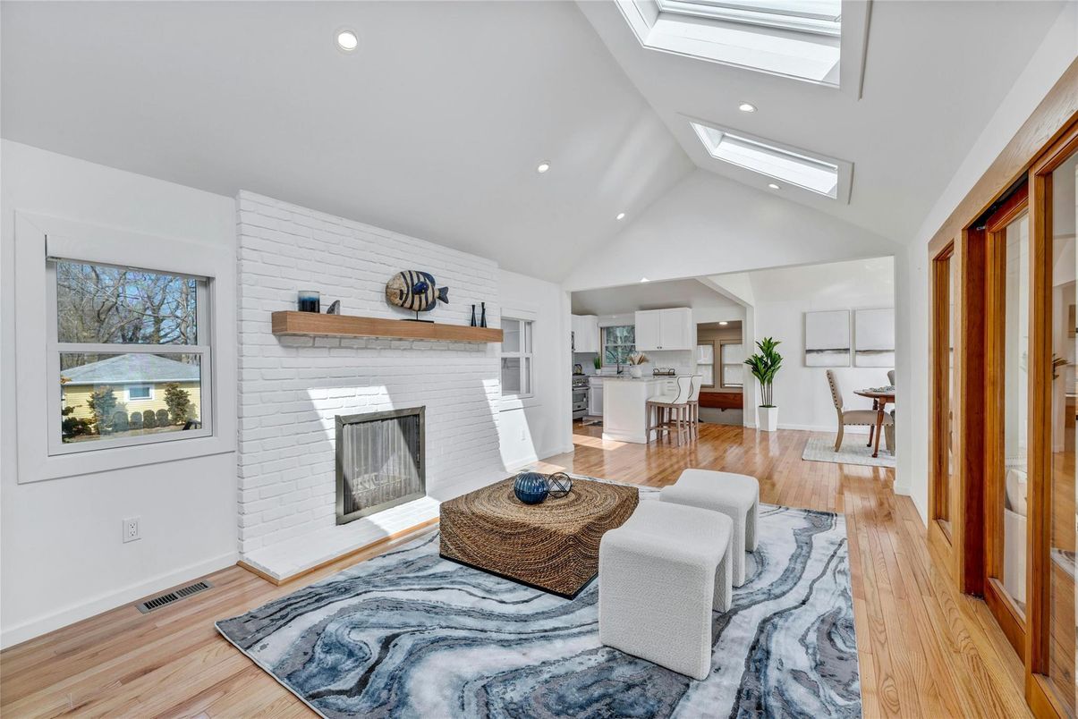 Dining room, Fireplace, Interior, Kitchen, Recessed Lighting, Stone Walls, Wood Texture Flooring