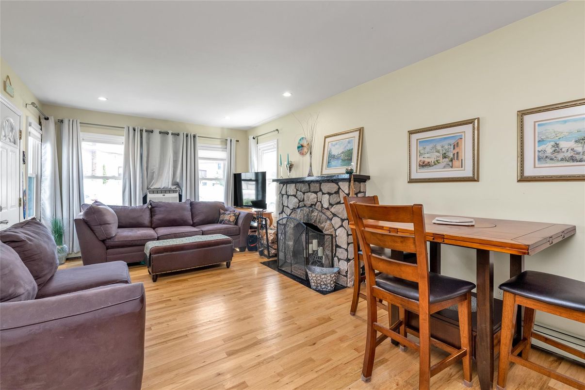 Dining room, Fireplace, Interior, Living room, Recessed Lighting, Wood Texture Flooring