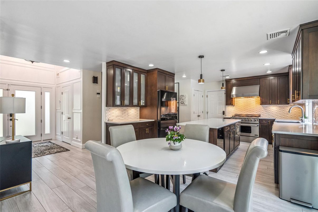 Dining room, Interior, Kitchen, Pendant Lights, Recessed Lighting, Stainless Steel Appliances, Wood Texture Flooring