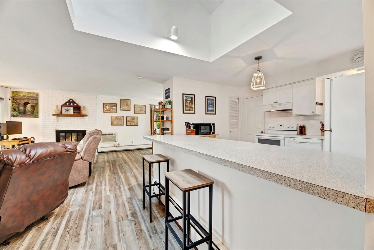 Fireplace, Interior, Kitchen, Pendant Lights, Recessed Lighting, Stone Walls, Wood Texture Flooring