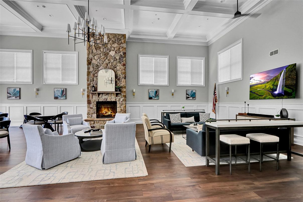 Chandelier, Fireplace, Interior, Living room, Pendant Lights, Recessed Lighting, Stone Walls, Wood Texture Flooring