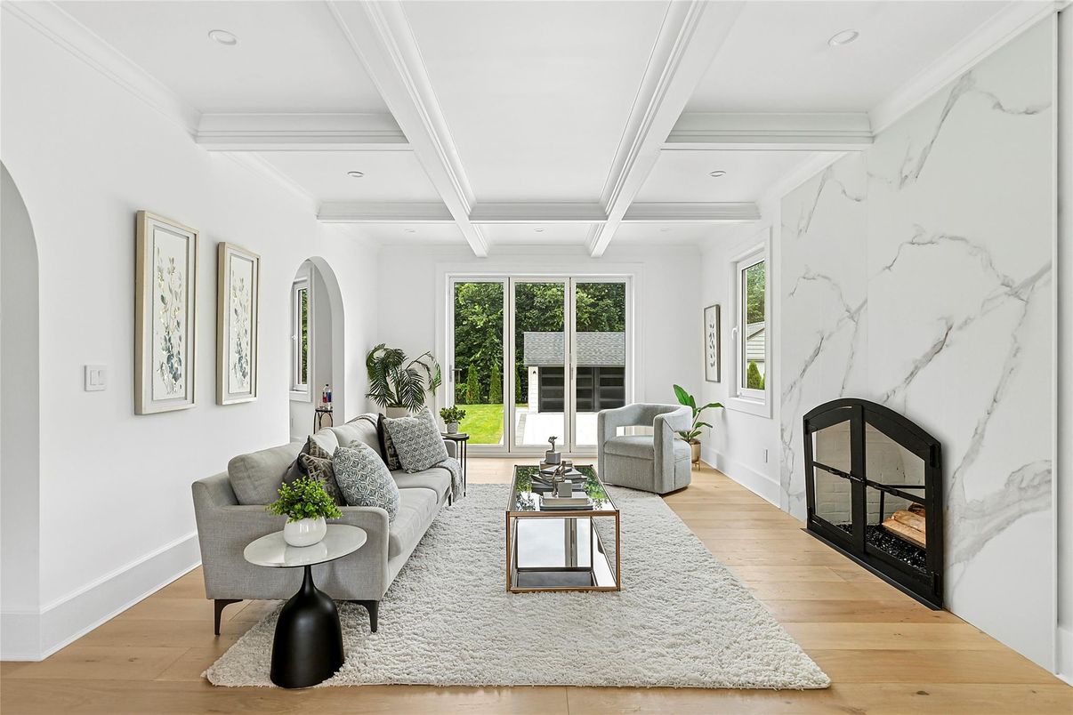 Fireplace, Interior, Living room, Marble Walls, Recessed Lighting, Wood Texture Flooring