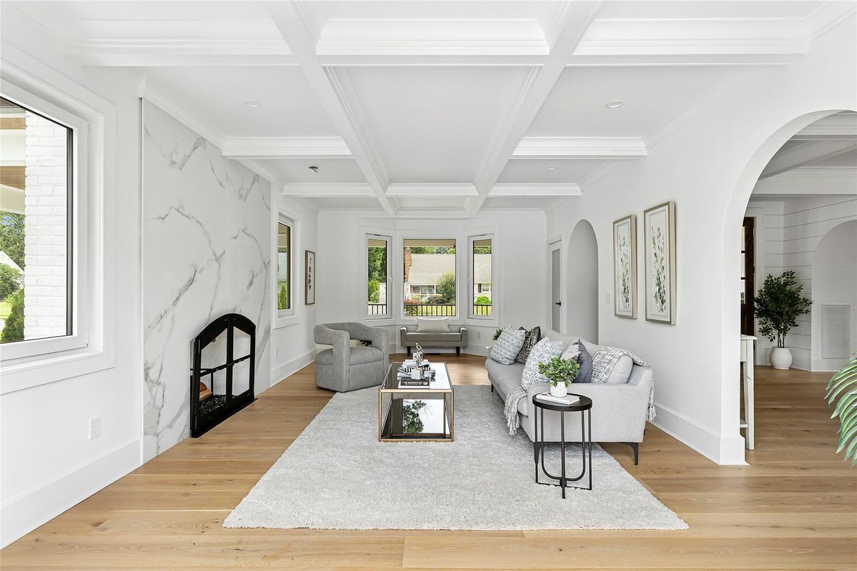 Fireplace, Interior, Living room, Marble Walls, Recessed Lighting, Wood Texture Flooring