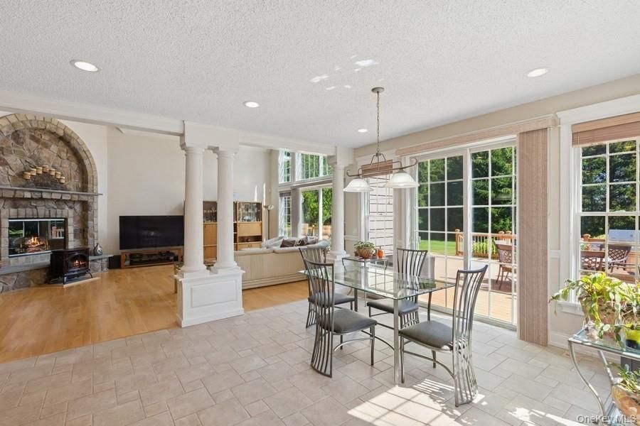 Dining room, Fireplace, Interior, Living room, Pendant Lights, Recessed Lighting, Wood Texture Flooring