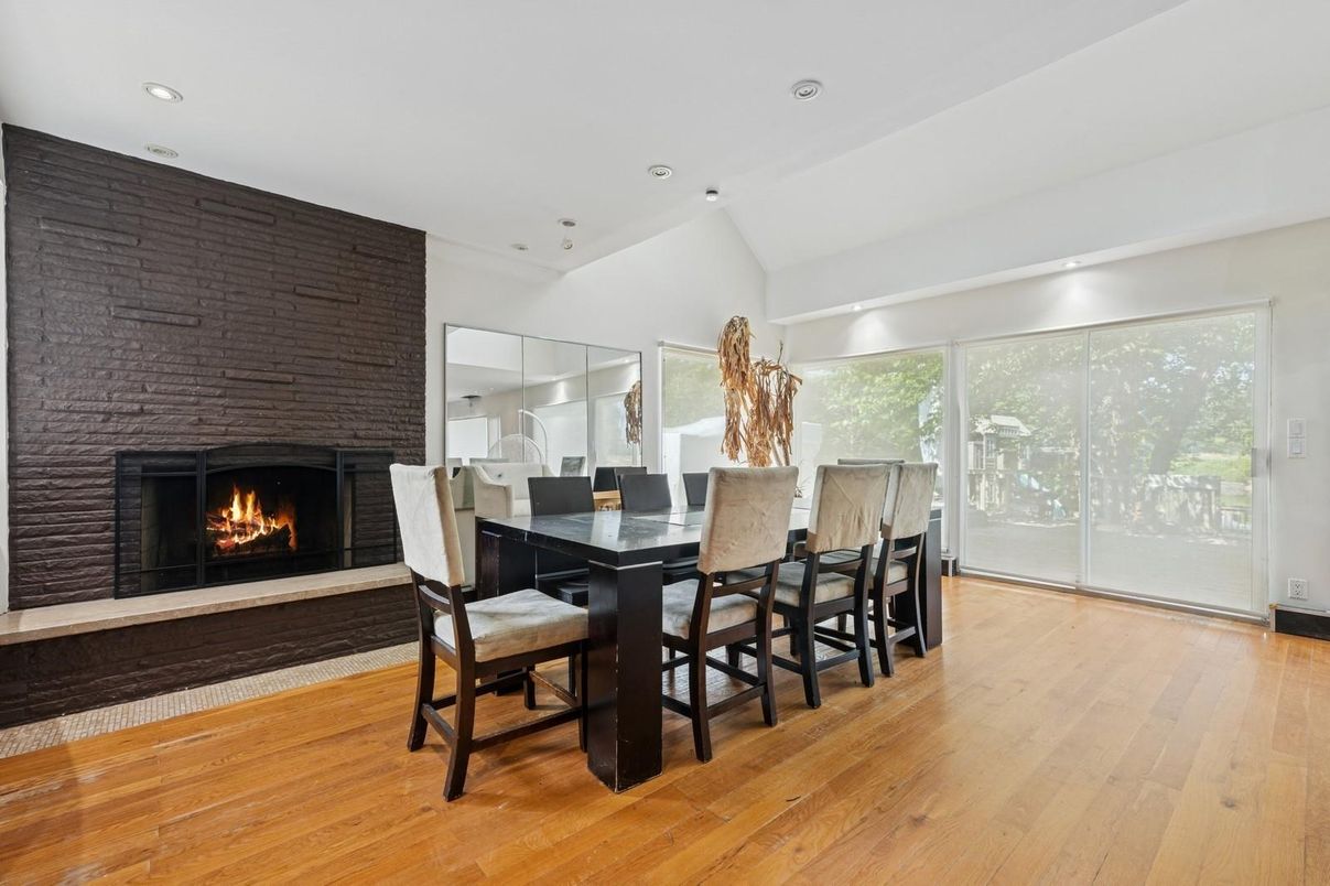 Dining room, Fireplace, Interior, Recessed Lighting, Stone Walls, Wood Texture Flooring