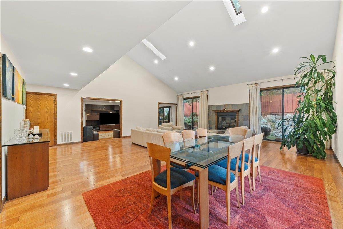Dining room, Fireplace, Interior, Living room, Recessed Lighting, Wood Texture Flooring