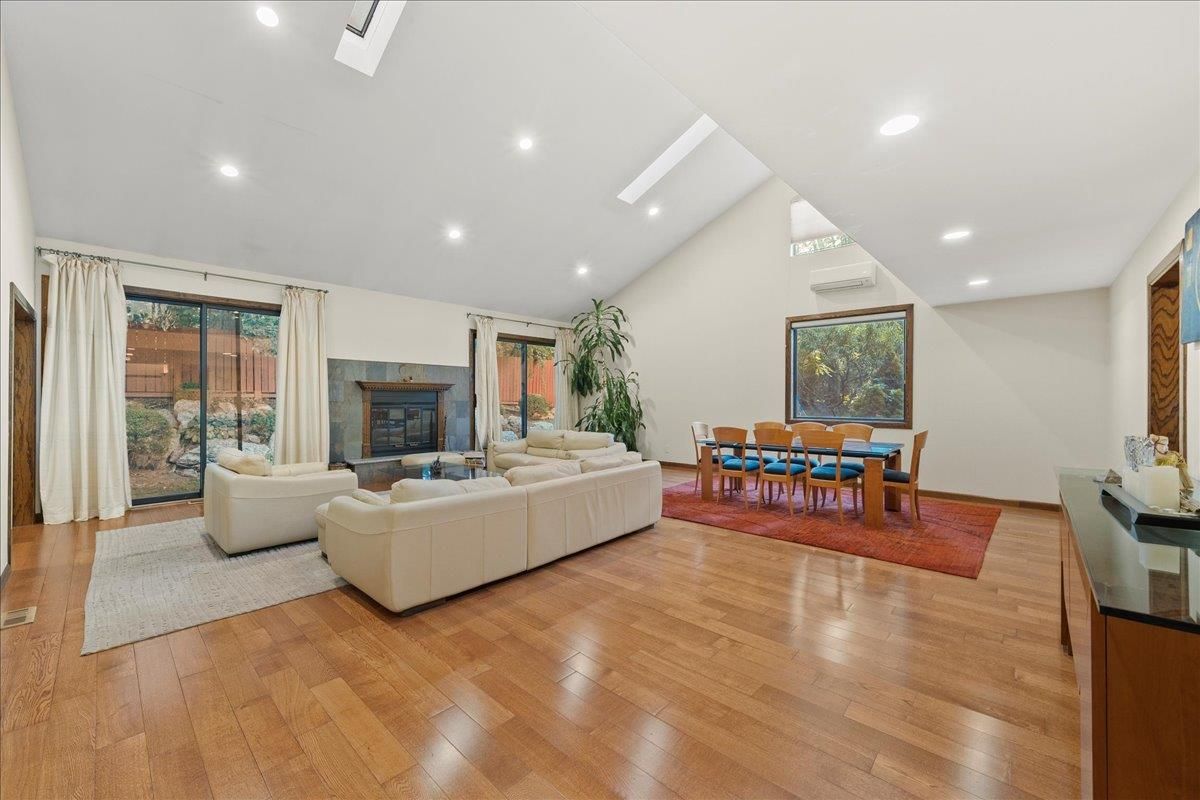 Dining room, Fireplace, Interior, Living room, Recessed Lighting, Wood Texture Flooring