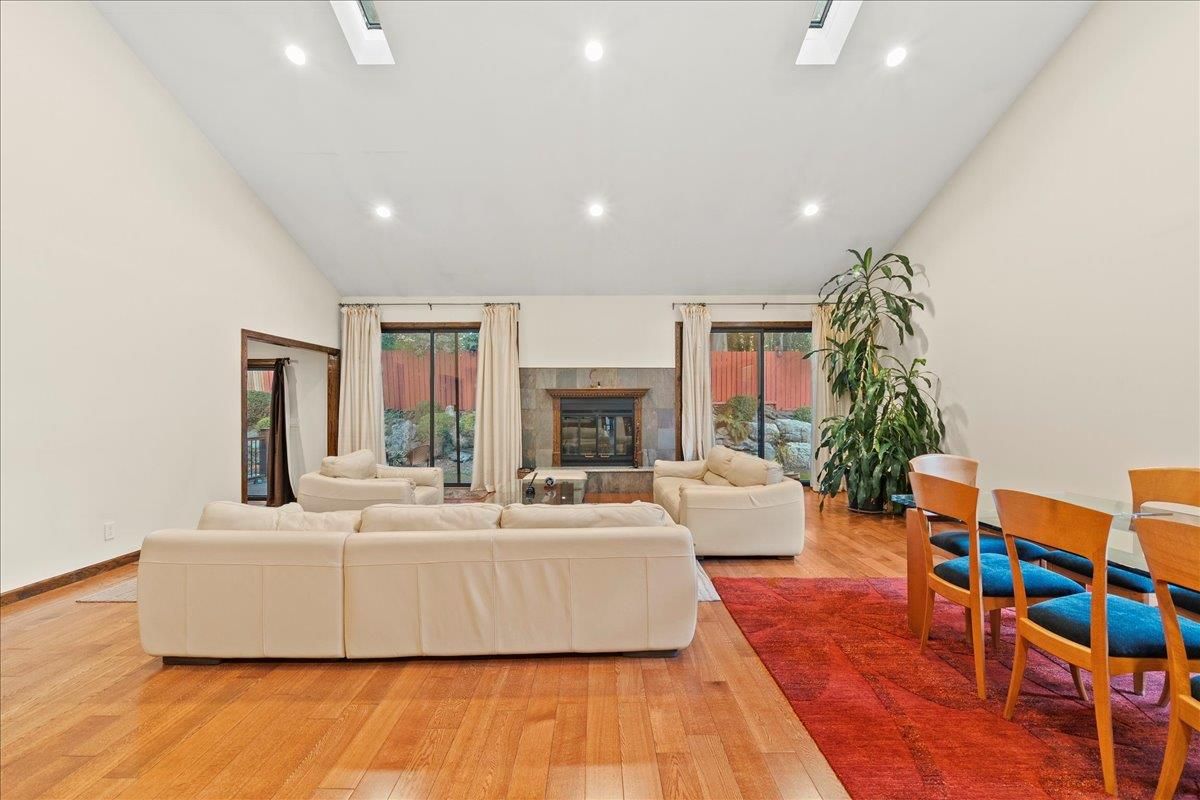 Dining room, Fireplace, Interior, Living room, Recessed Lighting, Wood Texture Flooring